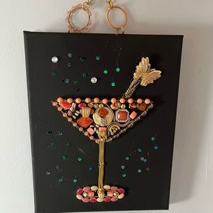Martini glass art created with vintage jewelry